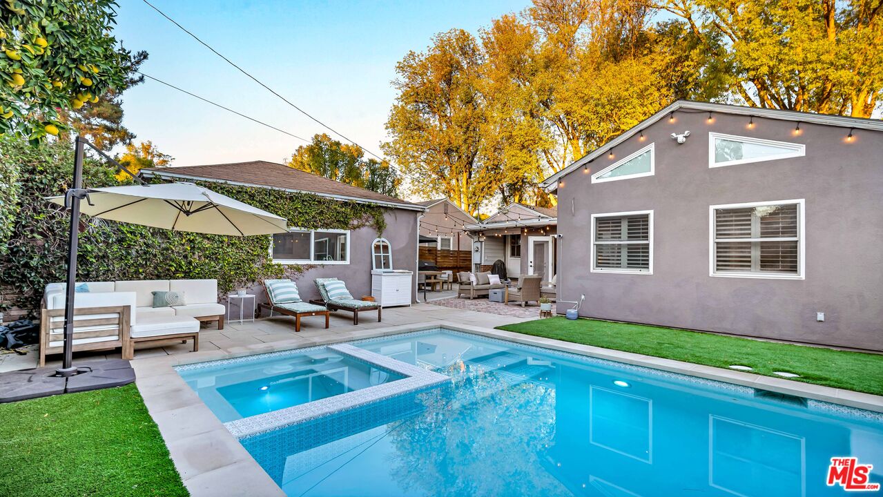 6557 Ruffner Avenue Lake Balboa, CA 91406 - Photo 20 of 31 a backyard of a house with yard table and chairs