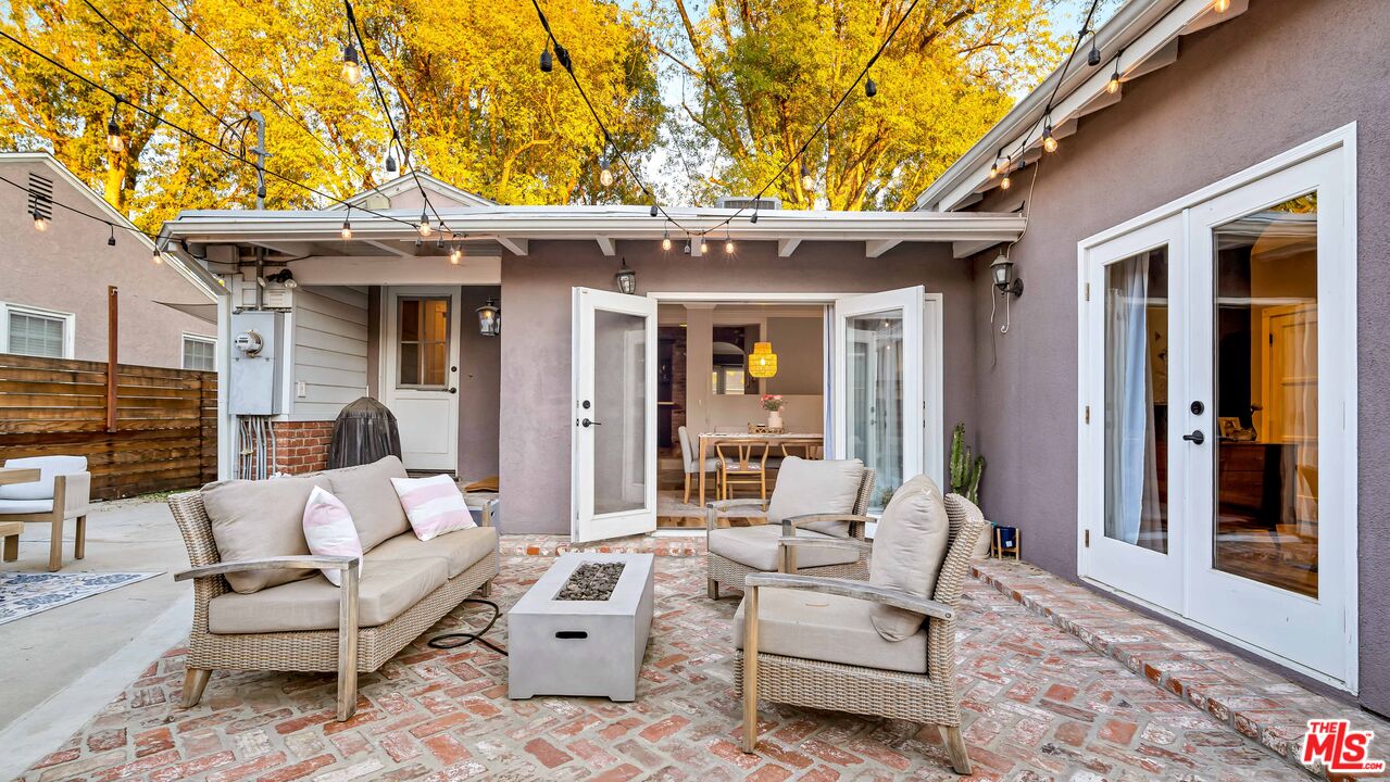 6557 Ruffner Avenue Lake Balboa, CA 91406 - Photo 21 of 31 a view of a patio with couches table and chairs and potted plants