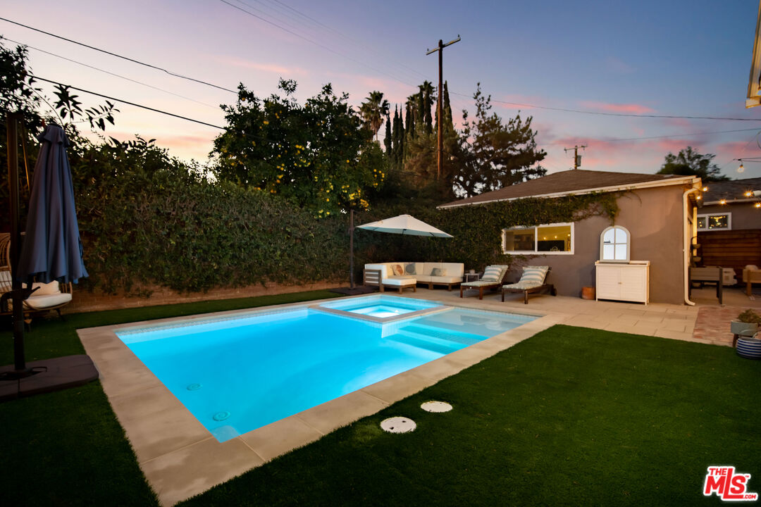 6557 Ruffner Avenue Lake Balboa, CA 91406 - Photo 23 of 31 a view of a house with a swimming pool