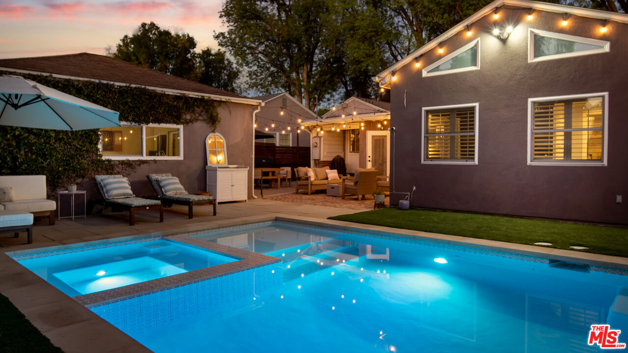 6557 Ruffner Avenue Lake Balboa, CA 91406 - Photo 25 of 31 a backyard of a house with yard and outdoor seating