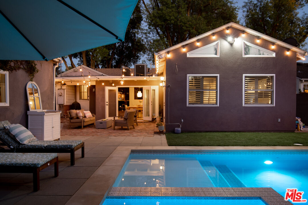 6557 Ruffner Avenue Lake Balboa, CA 91406 - Photo 26 of 31 a backyard of a house with yard and outdoor seating