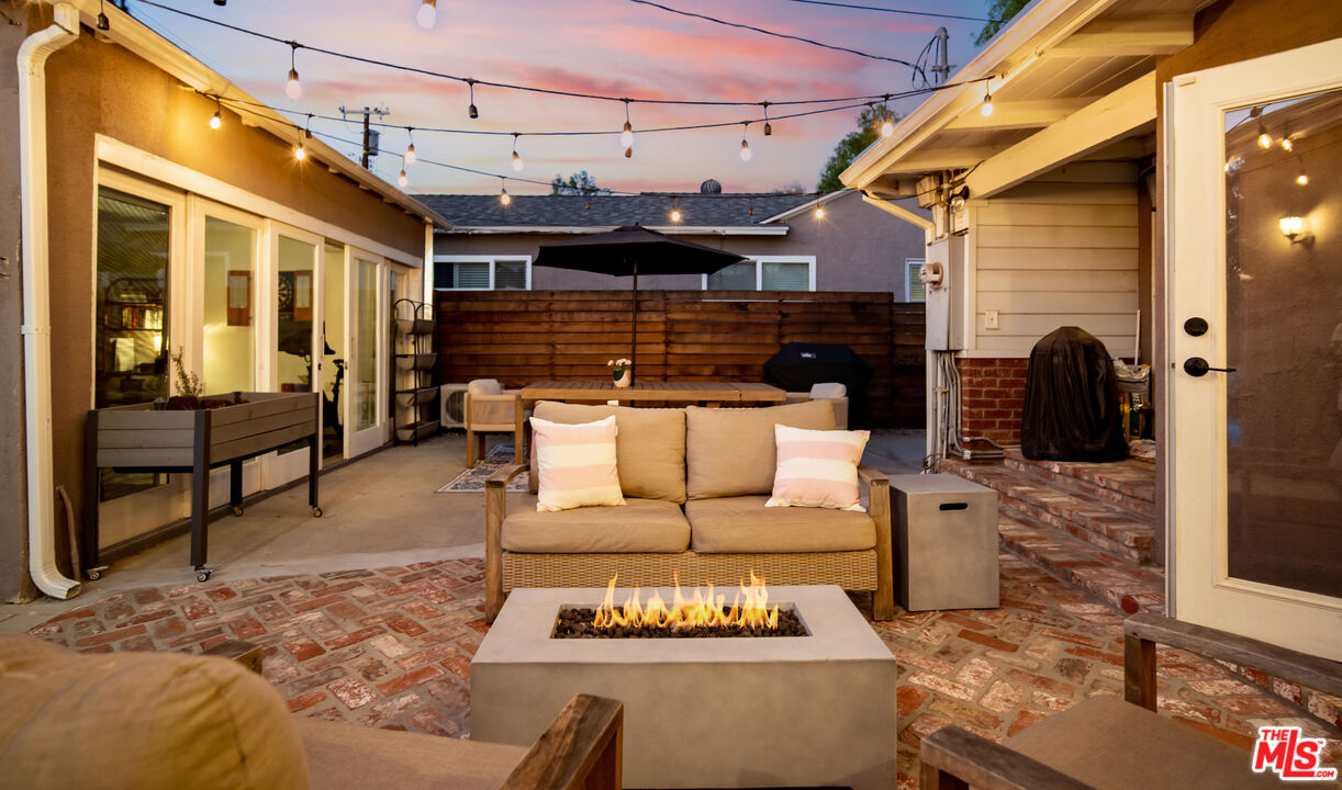 6557 Ruffner Avenue Lake Balboa, CA 91406 - Photo 27 of 31 a view of a patio with couches chairs and wooden floor