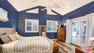 6557 Ruffner Avenue Lake Balboa, CA 91406 - Photo 8 of 31 a bedroom with a bed and wooden floor