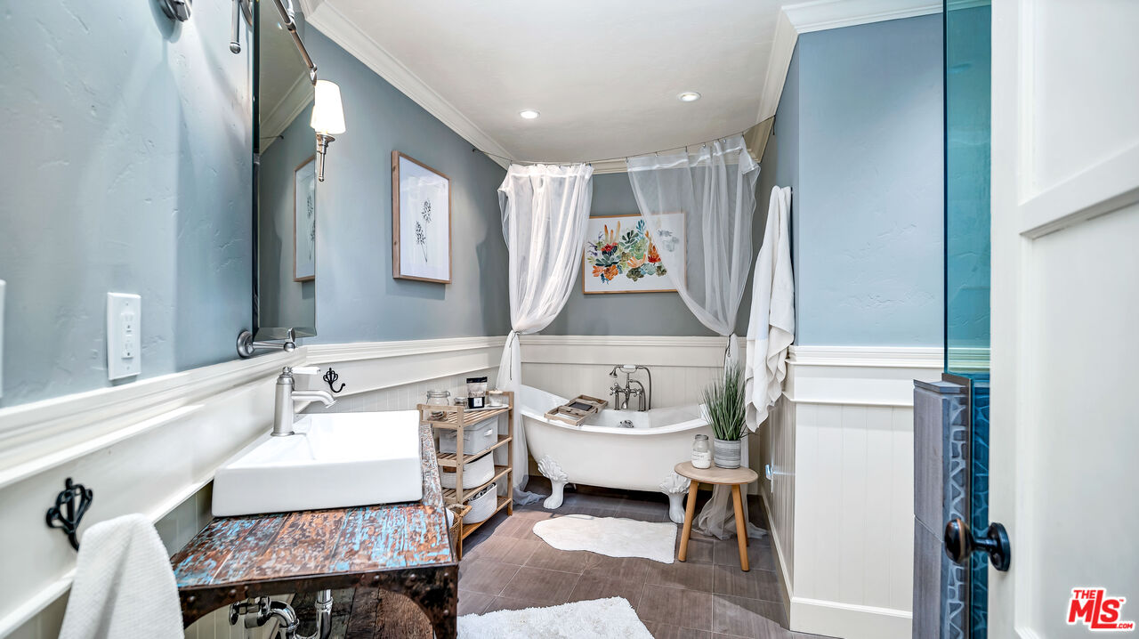 6557 Ruffner Avenue Lake Balboa, CA 91406 - Photo 10 of 31 a bathroom with a sink mirror and a toilet