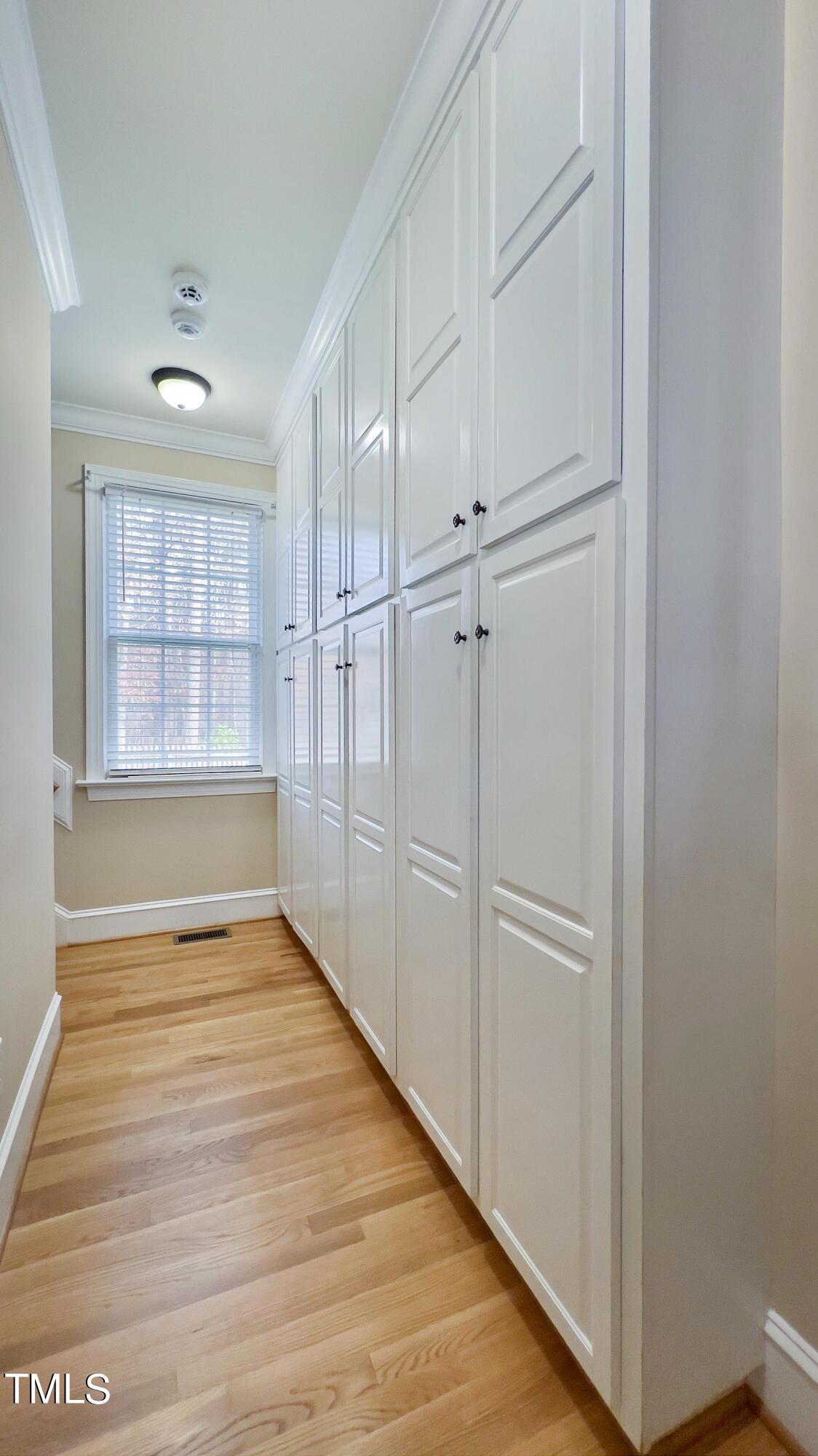 8928 Windjammer Drive Raleigh, NC 27615 - Photo 13 of 44 Large drop zone with floor to ceiling cabinets for easy organizing