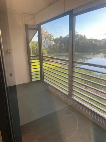 a view of a room with a large window