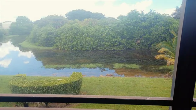 a view of a yard from a balcony