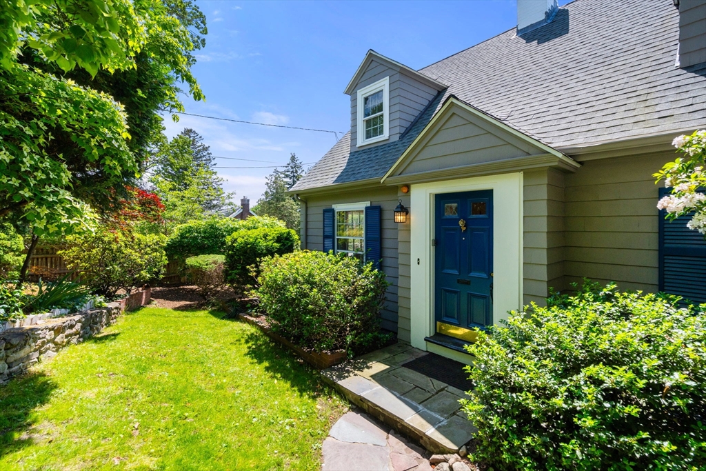107 Stoneleigh Road Watertown, MA 02472 - Photo 12 of 42 a view of a house with a yard and potted plants