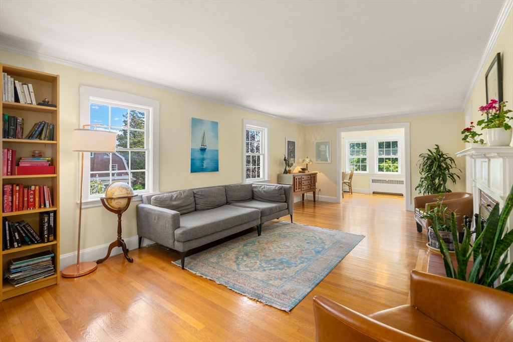 107 Stoneleigh Road Watertown, MA 02472 - Photo 20 of 42 a living room with furniture and a book shelf