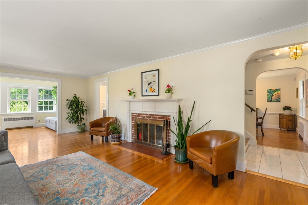107 Stoneleigh Road Watertown, MA 02472 - Photo 21 of 42 a living room with furniture and a fireplace