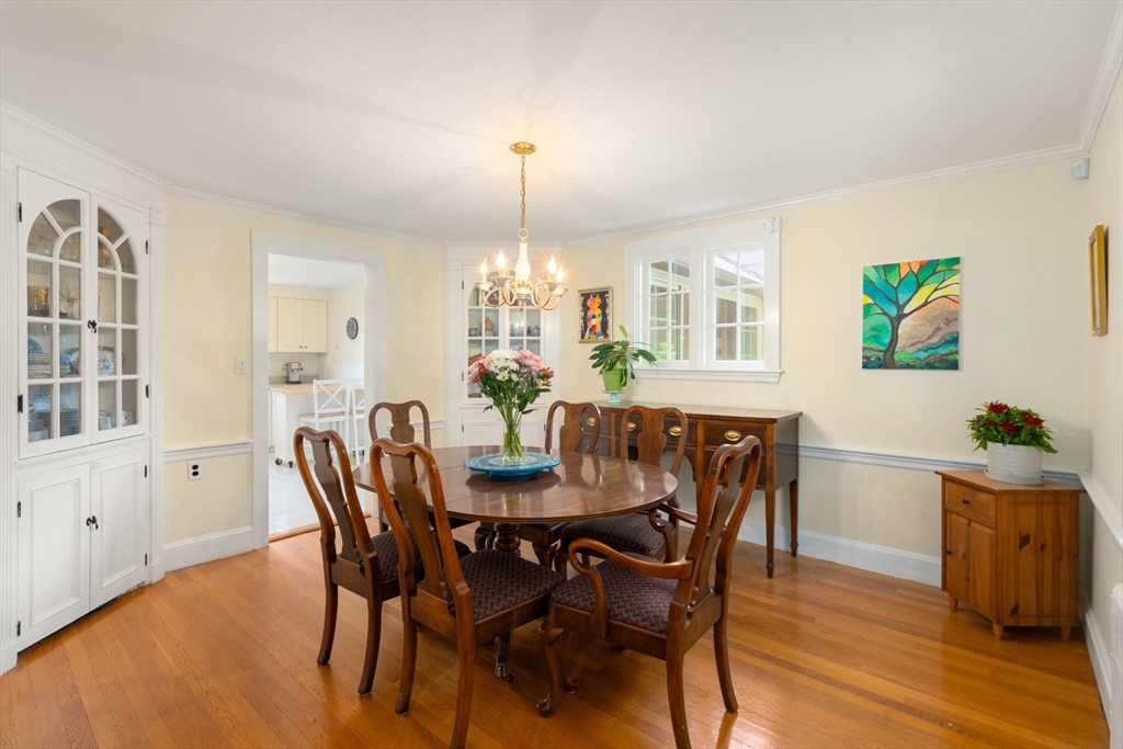 107 Stoneleigh Road Watertown, MA 02472 - Photo 24 of 42 a view of a dining room with furniture and chandelier