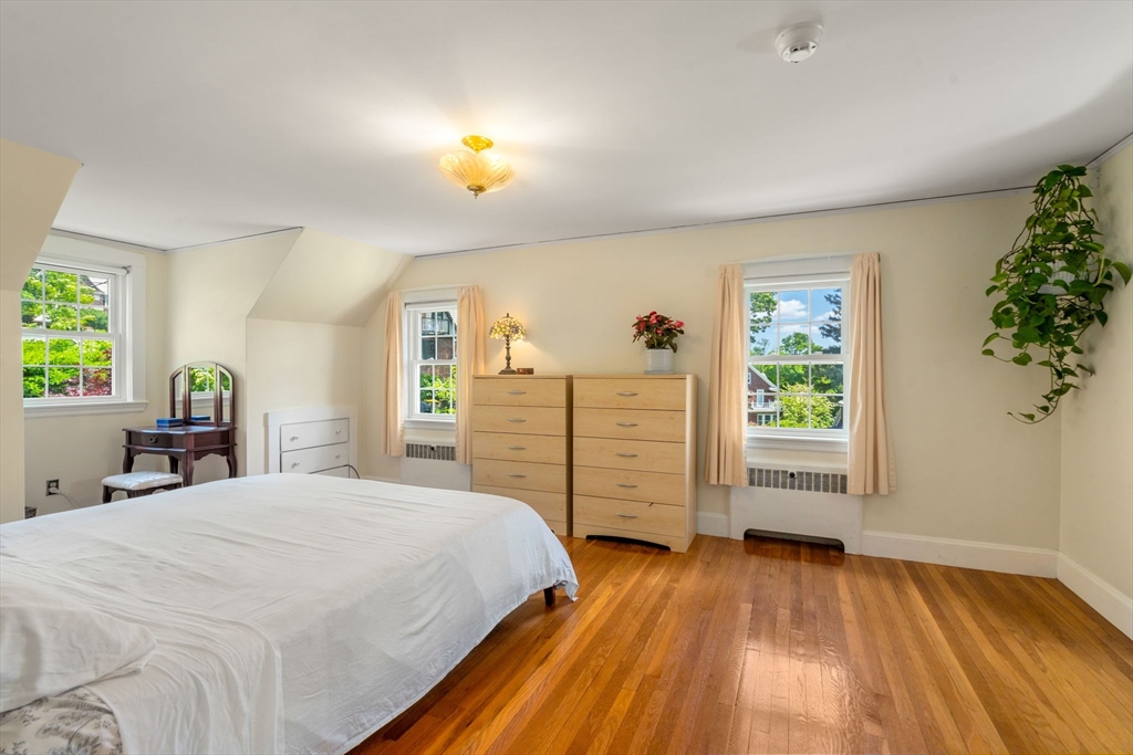 107 Stoneleigh Road Watertown, MA 02472 - Photo 28 of 42 a bedroom with a bed and a window