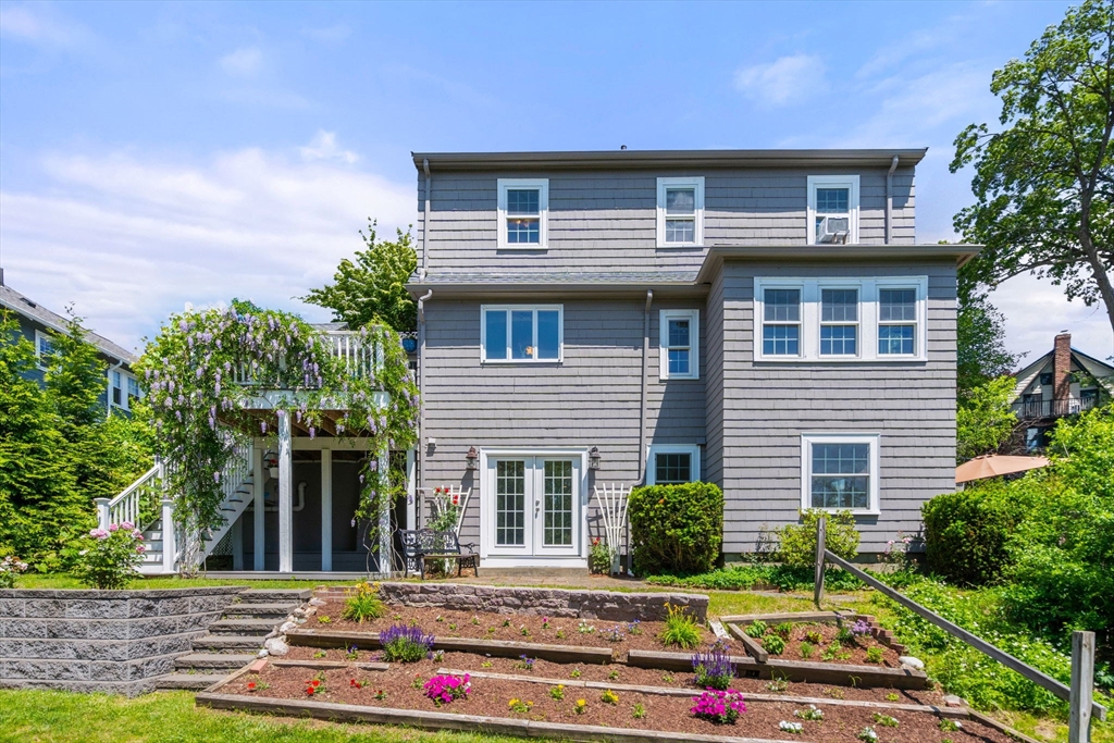 107 Stoneleigh Road Watertown, MA 02472 - Photo 3 of 42 a front view of a house with yard
