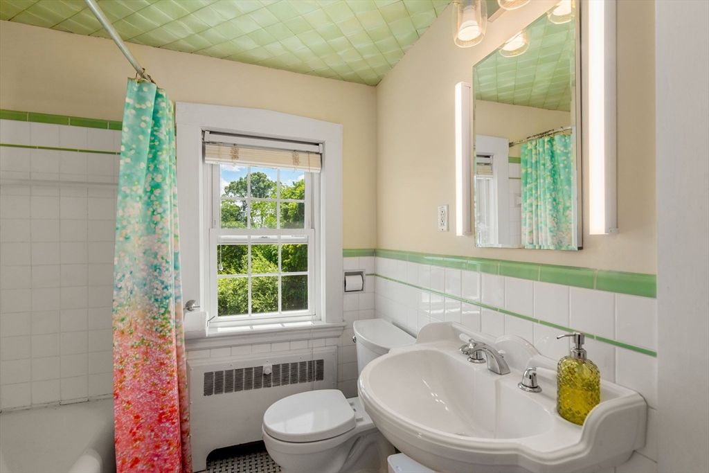 107 Stoneleigh Road Watertown, MA 02472 - Photo 32 of 42 a bathroom with a sink and a toilet