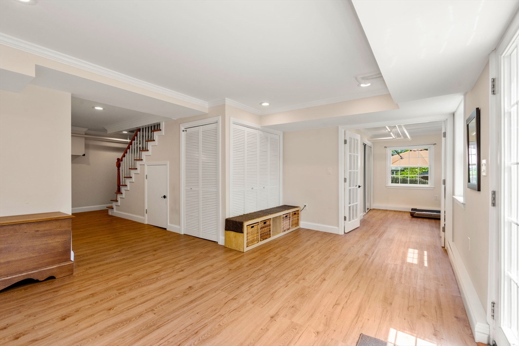 107 Stoneleigh Road Watertown, MA 02472 - Photo 34 of 42 a view of an empty room with wooden floor and a window