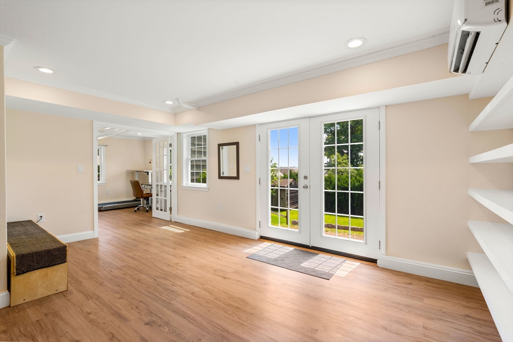 107 Stoneleigh Road Watertown, MA 02472 - Photo 35 of 42 a view of a livingroom with wooden floor and furniture