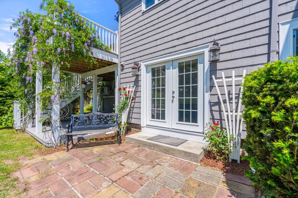 107 Stoneleigh Road Watertown, MA 02472 - Photo 7 of 42 a view of house with outdoor seating and a potted plant