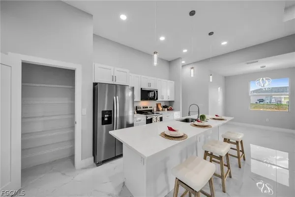 an empty room with a ceiling fan and a window