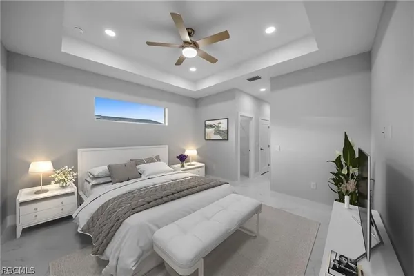 a view of a chandelier fan and entryway