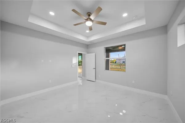 an aerial view of a house with a yard basket ball court and outdoor seating