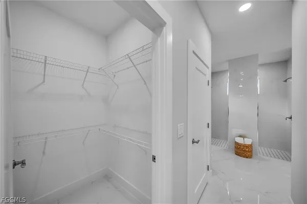 an aerial view of a house with garden space and lake view