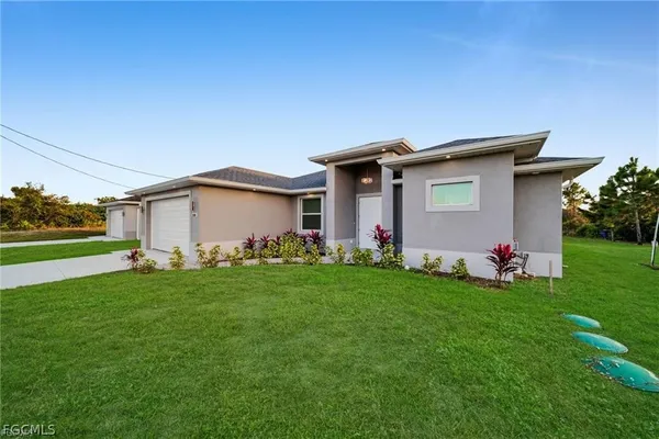 a front view of a house with a yard