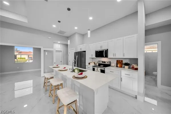 a bathroom with a glass shower door and a bathroom