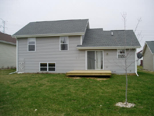 4192 Linden Road Rockford, IL 61109 - Photo 5 of 7 a backyard of a house with table and chairs