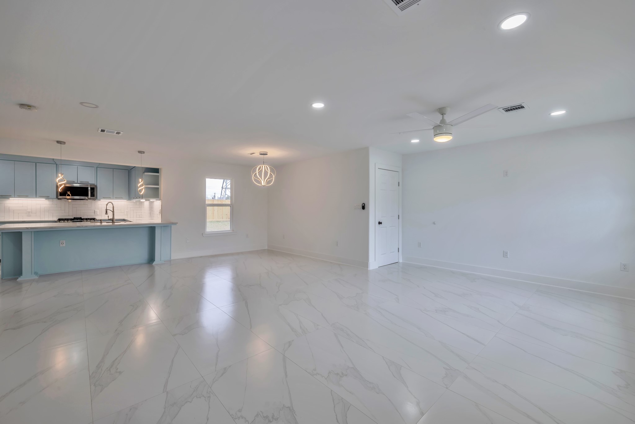8709 Tarbell Road Houston, TX 77034 - Photo 3 of 25 a view of an empty room with window and wooden floor