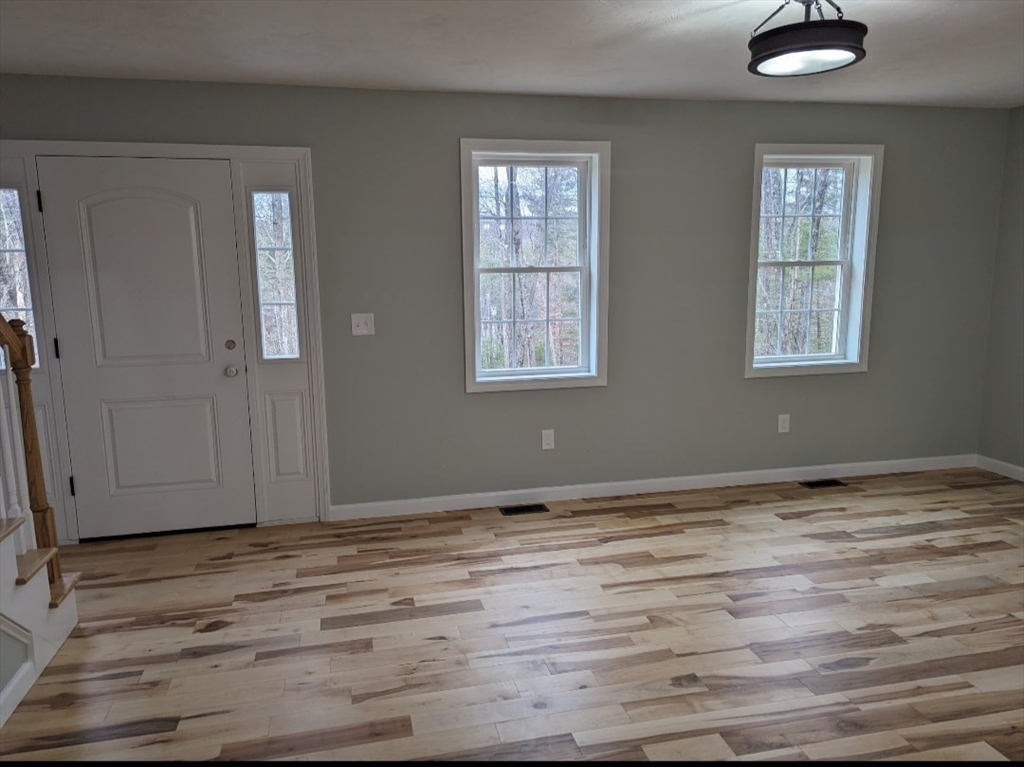 508 Old County Road Holland, MA 01521 - Photo 18 of 42 a view of an empty room with wooden floor and a window