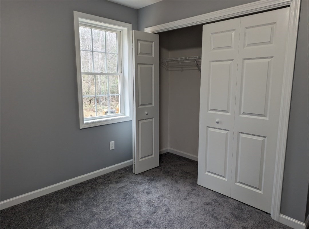 508 Old County Road Holland, MA 01521 - Photo 21 of 42 an empty room with windows and closet