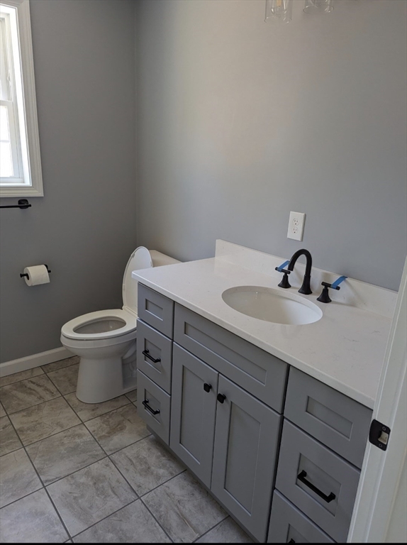 508 Old County Road Holland, MA 01521 - Photo 26 of 42 a bathroom with a sink toilet and a window