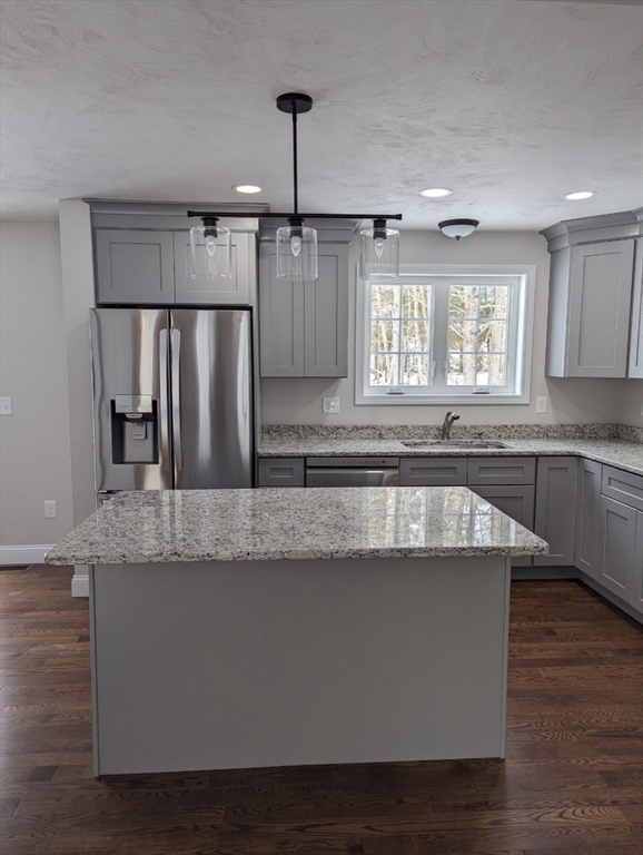 508 Old County Road Holland, MA 01521 - Photo 10 of 42 a large kitchen with granite countertop a sink a window and stainless steel appliances