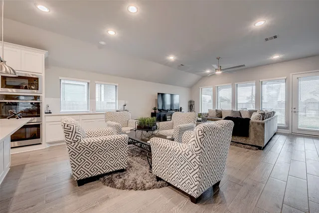 a living room with furniture and a window
