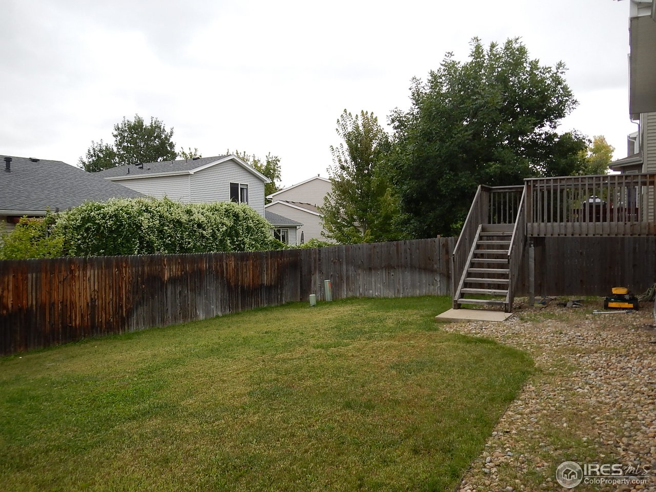 1302 Trail Ridge Road Longmont, CO 80504 - Photo 3 of 5 a view of a backyard with a slide