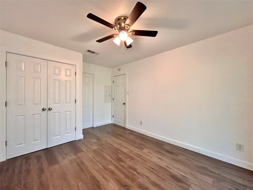 6409 Burns Street, Unit 305 Austin, TX 78752 - Photo 11 of 19 a view of an empty room with wooden floor