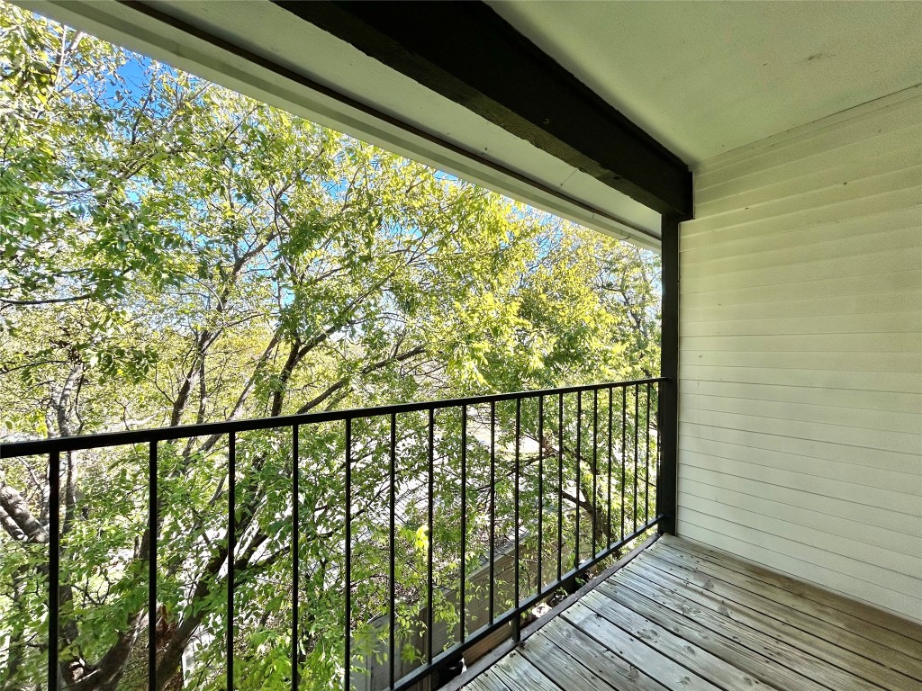 6409 Burns Street, Unit 305 Austin, TX 78752 - Photo 12 of 19 a view of a balcony with wooden floor