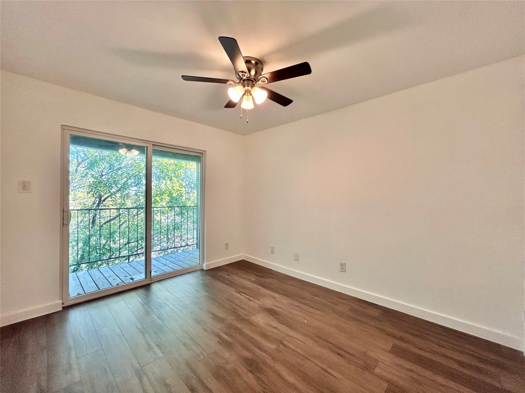6409 Burns Street, Unit 305 Austin, TX 78752 - Photo 10 of 19 a view of an empty room with wooden floor and a window