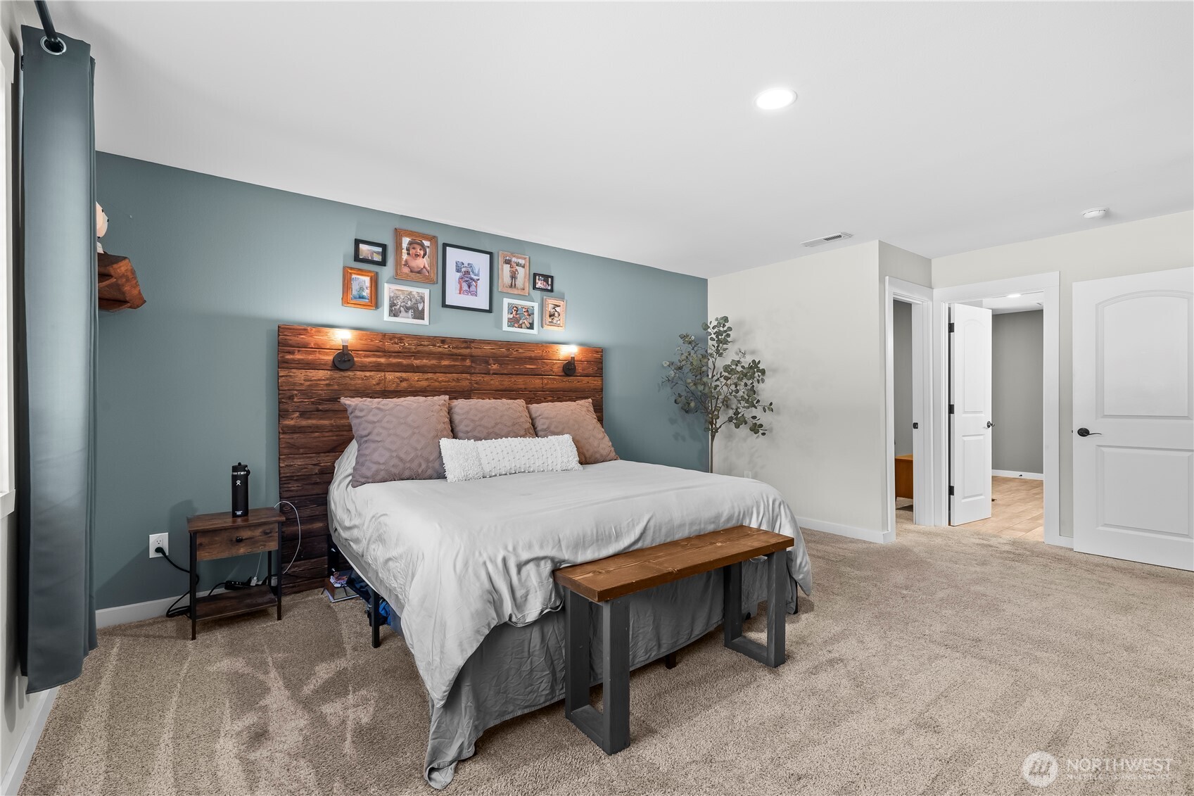 971 Old Cedars Road Cle Elum, WA 98922 - Photo 15 of 39 a bedroom with a bed and a chandelier