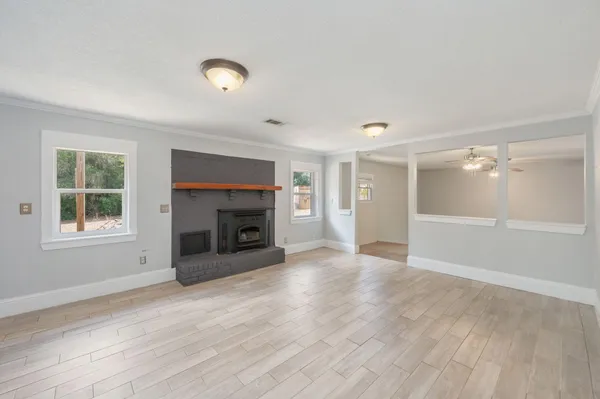 a kitchen with a stove and white cabinets