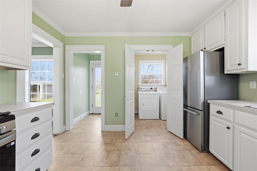 3005 Windsor Avenue Waco, TX 76708 - Photo 12 of 37 a view of kitchen with refrigerator cabinets and window
