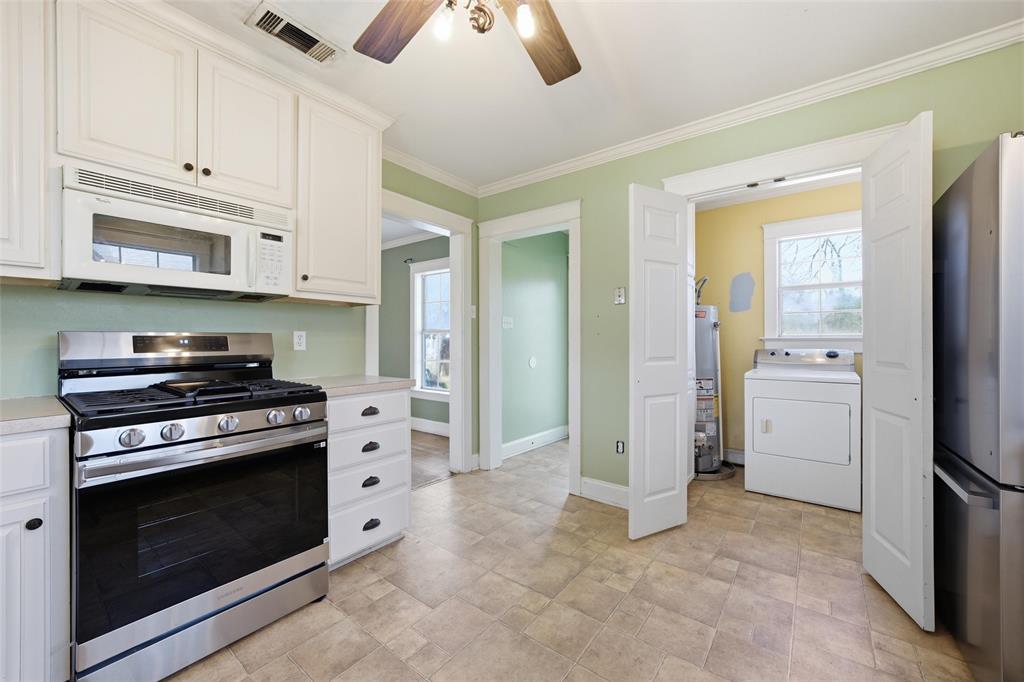 3005 Windsor Avenue Waco, TX 76708 - Photo 13 of 37 a kitchen with cabinets and steel stainless steel appliances
