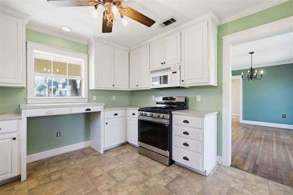 3005 Windsor Avenue Waco, TX 76708 - Photo 14 of 37 a kitchen with stainless steel appliances granite countertop a stove and a cabinets