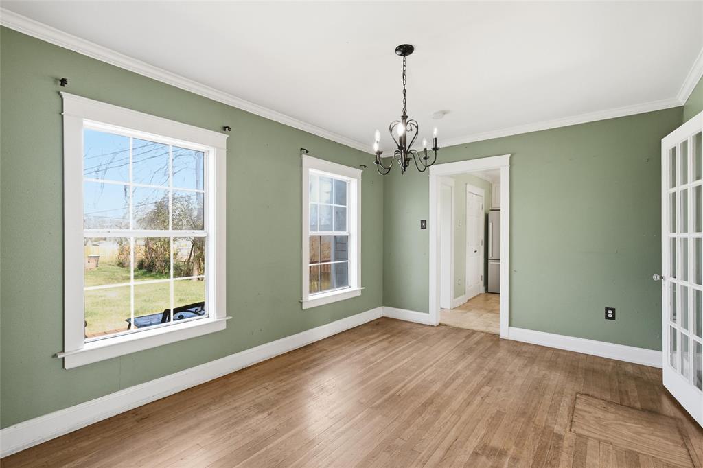 3005 Windsor Avenue Waco, TX 76708 - Photo 16 of 37 a view of an empty room with wooden floor and a window