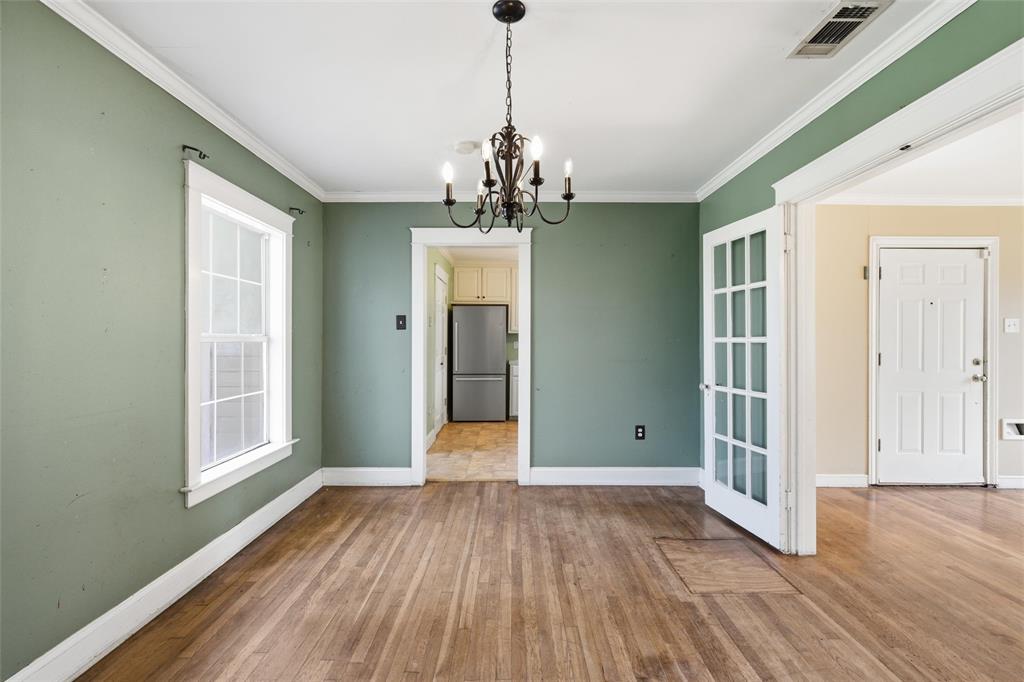 3005 Windsor Avenue Waco, TX 76708 - Photo 17 of 37 a view of a livingroom with wooden floor and chandelier