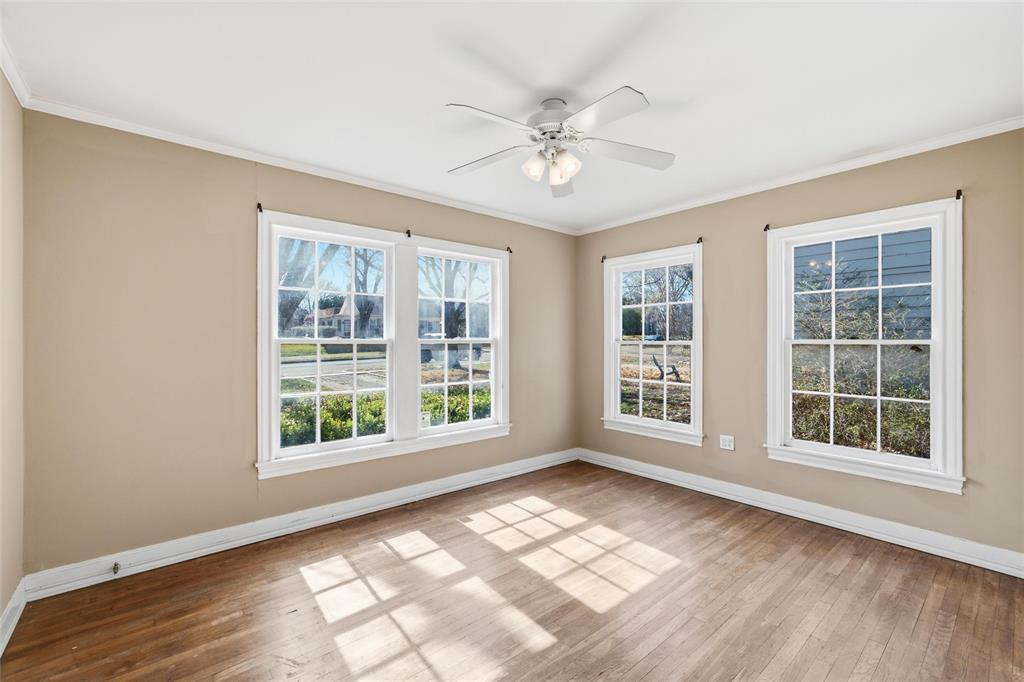 3005 Windsor Avenue Waco, TX 76708 - Photo 18 of 37 an empty room with wooden floor and windows