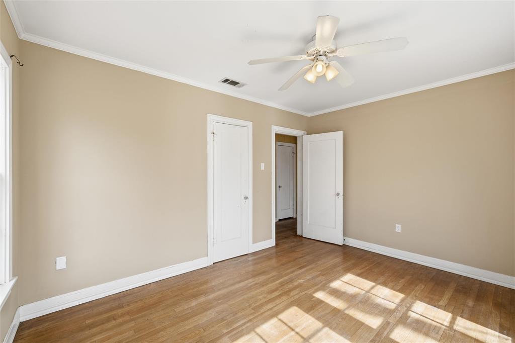 3005 Windsor Avenue Waco, TX 76708 - Photo 19 of 37 a view of a room with a ceiling fan and wooden floor