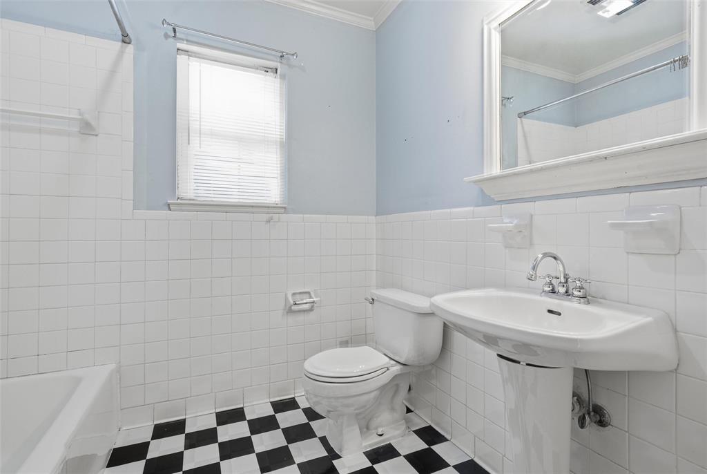 3005 Windsor Avenue Waco, TX 76708 - Photo 21 of 37 a bathroom with a sink a toilet and a mirror