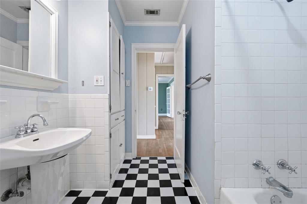 3005 Windsor Avenue Waco, TX 76708 - Photo 22 of 37 a bathroom with a sink a toilet and shower