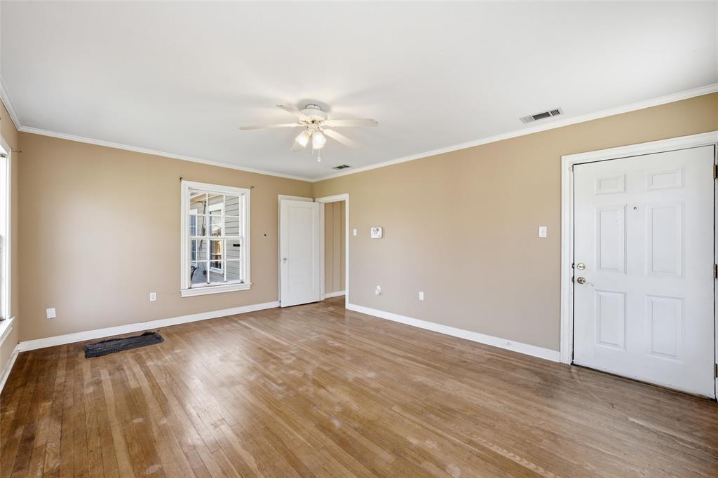 3005 Windsor Avenue Waco, TX 76708 - Photo 24 of 37 a view of an empty room with a window and wooden floor